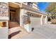 Front entry with stone accents and three-car garage at 22432 N 48Th St, Phoenix, AZ 85054