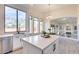 Modern kitchen with white cabinets, stainless steel appliances, and island at 22432 N 48Th St, Phoenix, AZ 85054