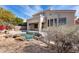 Relaxing backyard oasis with a sparkling pool and rock accents at 22432 N 48Th St, Phoenix, AZ 85054