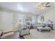 Cozy living room with a comfy couch and a ceiling fan at 24191 N Desert Dr, Florence, AZ 85132