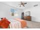 Tranquil bedroom featuring carpet, a large window for ample light, and a wooden dresser at 2530 W Sable Ave, Apache Junction, AZ 85120