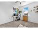 Inviting bedroom with natural light, a ceiling fan and a small desk at 2530 W Sable Ave, Apache Junction, AZ 85120