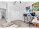 Bright bedroom featuring a ceiling fan, closet and a desk at 2530 W Sable Ave, Apache Junction, AZ 85120