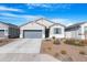 Beautiful single-story home with desert landscaping, gray stucco exterior, and complementary gray garage door at 2530 W Sable Ave, Apache Junction, AZ 85120