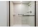 Clean bathroom with walk-in shower and built-in shelving at 2571 N Miller Rd, Scottsdale, AZ 85257