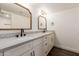 Updated bathroom with double vanity and modern fixtures at 2571 N Miller Rd, Scottsdale, AZ 85257