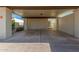 Covered carport with concrete flooring and access to the unit at 2571 N Miller Rd, Scottsdale, AZ 85257