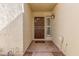 Front door with security gate and welcome mat at 2571 N Miller Rd, Scottsdale, AZ 85257