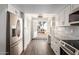 Bright kitchen featuring a breakfast nook and updated cabinetry at 2571 N Miller Rd, Scottsdale, AZ 85257