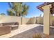 Private patio with brick pavers and wicker furniture at 2571 N Miller Rd, Scottsdale, AZ 85257