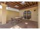 Covered patio with seating and access to the interior at 2571 N Miller Rd, Scottsdale, AZ 85257