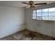 Small bedroom with ceiling fan and window at 2613 E Lynne Ln, Phoenix, AZ 85042