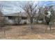 Ranch style home with mature trees and a fenced yard at 2613 E Lynne Ln, Phoenix, AZ 85042