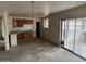 Kitchen with wood cabinets and sliding glass door at 2613 E Lynne Ln, Phoenix, AZ 85042