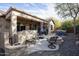 Outdoor kitchen and hot tub in a backyard at 26293 W Sierra Pinta Dr, Buckeye, AZ 85396