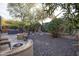 Hot tub and fire pit in a gravel backyard at 26293 W Sierra Pinta Dr, Buckeye, AZ 85396