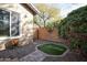 Artificial turf and brick border in a backyard at 26293 W Sierra Pinta Dr, Buckeye, AZ 85396