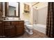 Bathroom with tub, vanity, and updated tile flooring at 26293 W Sierra Pinta Dr, Buckeye, AZ 85396