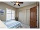 Bedroom with double closet and ceiling fan at 26293 W Sierra Pinta Dr, Buckeye, AZ 85396