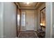 Bright and airy entryway with wood barn door and tile floor at 26293 W Sierra Pinta Dr, Buckeye, AZ 85396