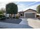 Single-story home with attractive landscaping and two-car garage at 26293 W Sierra Pinta Dr, Buckeye, AZ 85396