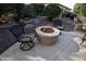 Charming fire pit area with comfortable seating for outdoor relaxation at 26293 W Sierra Pinta Dr, Buckeye, AZ 85396