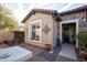 Inviting front courtyard with sitting area and stone accents at 26293 W Sierra Pinta Dr, Buckeye, AZ 85396