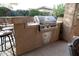 High-end stainless steel grill built into outdoor kitchen at 26293 W Sierra Pinta Dr, Buckeye, AZ 85396