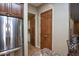 Kitchen area with stainless steel refrigerator and pantry at 26293 W Sierra Pinta Dr, Buckeye, AZ 85396