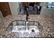 Double stainless steel sink with granite countertop at 26293 W Sierra Pinta Dr, Buckeye, AZ 85396