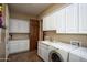 Bright laundry room with ample storage at 26293 W Sierra Pinta Dr, Buckeye, AZ 85396