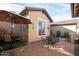 Outdoor patio with seating area and lush landscaping at 26293 W Sierra Pinta Dr, Buckeye, AZ 85396