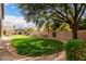 Landscaped backyard featuring a grassy lawn and stone border at 2702 S Joplin --, Mesa, AZ 85209