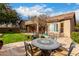 Relaxing backyard patio with seating area and lush green lawn at 2702 S Joplin --, Mesa, AZ 85209