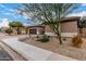 Tan house with brown garage door and desert landscaping at 2702 S Joplin --, Mesa, AZ 85209