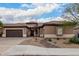 Front view of house with two-car garage and landscaping at 2702 S Joplin --, Mesa, AZ 85209