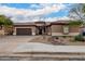 Front view of house with two-car garage and landscaping at 2702 S Joplin --, Mesa, AZ 85209