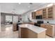 Modern kitchen with an island, wood cabinets, and ample counter space at 2702 S Joplin --, Mesa, AZ 85209