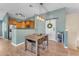 Bright dining area with wood table and chairs, adjacent to kitchen at 2725 E Mine Creek Rd # 2054, Phoenix, AZ 85024