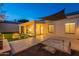 Evening view of backyard, covered patio, and fire pit at 2741 E Claire Dr, Phoenix, AZ 85032