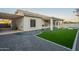 Artificial turf backyard with covered patio and gravel at 2741 E Claire Dr, Phoenix, AZ 85032