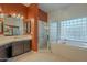 Spa-like bathroom with soaking tub, shower, and double vanity at 2741 E Claire Dr, Phoenix, AZ 85032