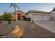 Two-story house with three-car garage and desert landscaping at 2741 E Claire Dr, Phoenix, AZ 85032