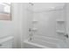 Simple bathroom with a shower/tub combo and built in shelving at 2811 N 212Th Dr, Buckeye, AZ 85396