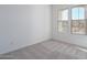 Bright bedroom with neutral walls and carpet, featuring large windows at 2811 N 212Th Dr, Buckeye, AZ 85396