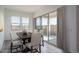 Dining area with a wooden table and sliding glass doors at 2811 N 212Th Dr, Buckeye, AZ 85396