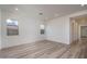 Bright living room with hardwood floors and ample natural light at 2811 N 212Th Dr, Buckeye, AZ 85396