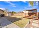 Large backyard with pergola, fire pit and pathway at 3020 E Lark Dr, Chandler, AZ 85286