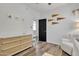 Bedroom with dresser, armchair, and black door at 3020 E Lark Dr, Chandler, AZ 85286