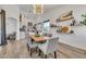 Dining room with wood table, gray chairs, and a stylish light fixture at 3020 E Lark Dr, Chandler, AZ 85286